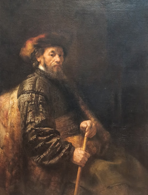 A Seated Man with a Stick Follower of Rembrandt