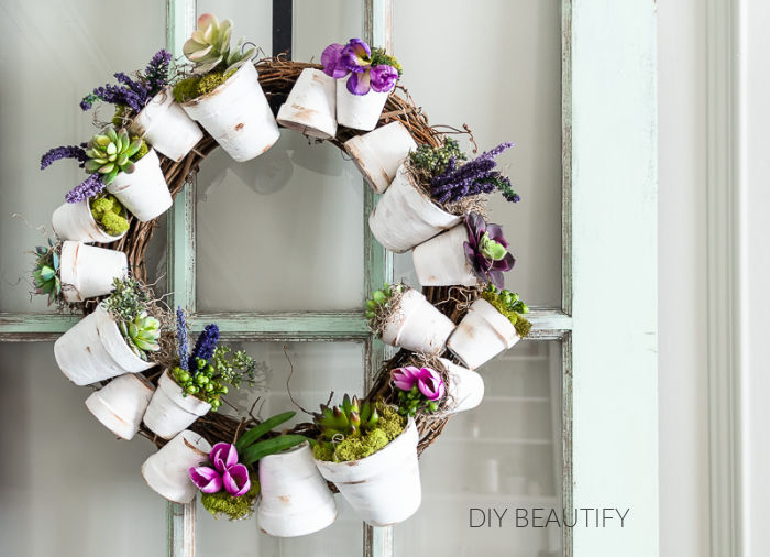 flower pot wreath with purple flowers and succulents