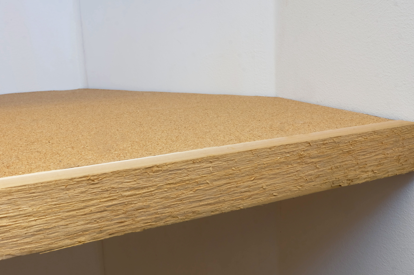 close up of finished cork lined cedar edged shelf