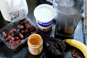 the ingredients for a banana, peanut butter and date smoothie with curly kale