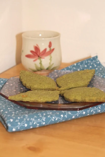 Plate of matcha tea leaf shortbread cookies.