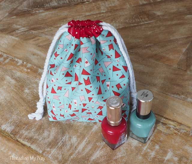 How to make a drawstring gift bag with a divider to hold nail polish. Tutorial by Threading My Way