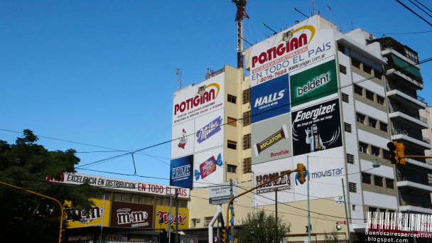 Advertising Overkill at a Wall in the La Boca Neighborhood in Buenos Aires, Argentina