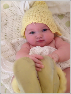 Baby with White Knit Blanket