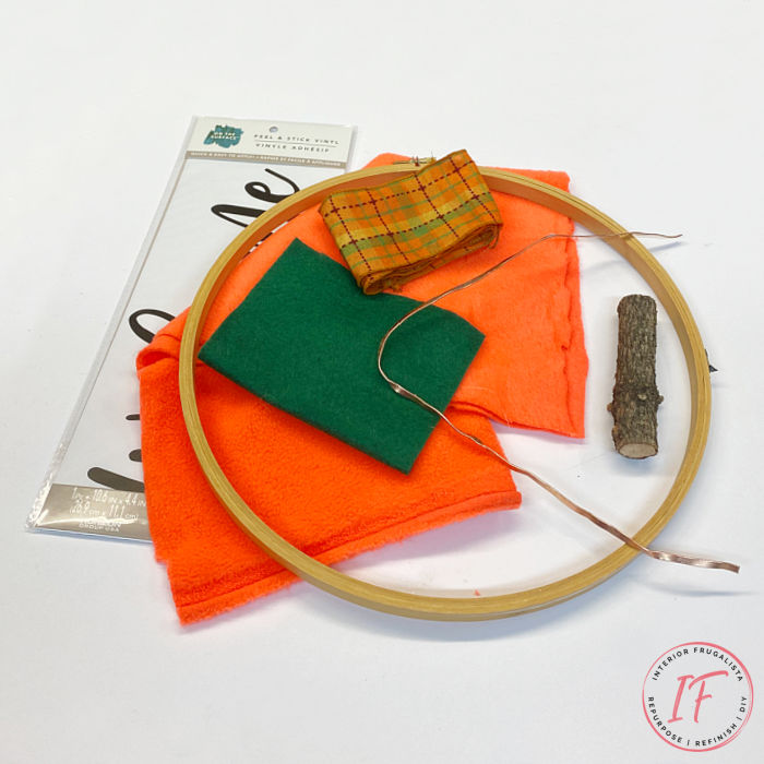 A simple easy peasy embroidery hoop pumpkin wreath tutorial for budget fall decorating with thrift finds, fabric scraps and ribbon you have on hand.