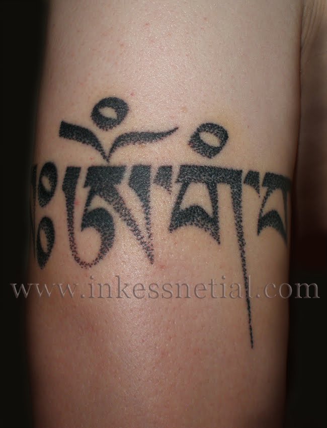 of the Uchen script tattooed in a dot effect Click here for tattoo