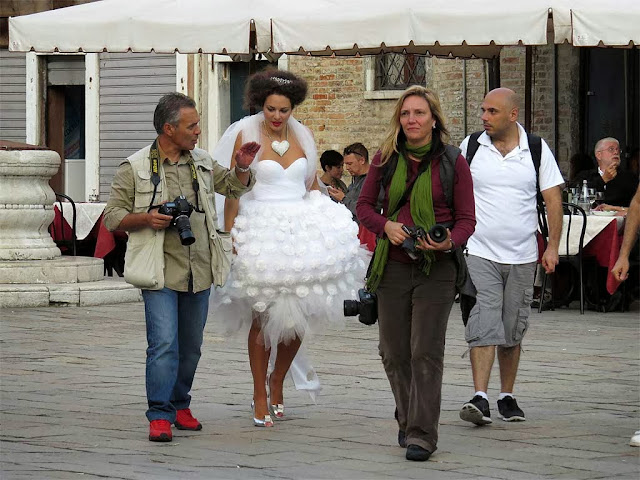 Model and photographers at work, Campo Santo Stefano, Venice