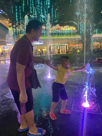 Miguel playing in the fountain at Ayala Fairview Terraces