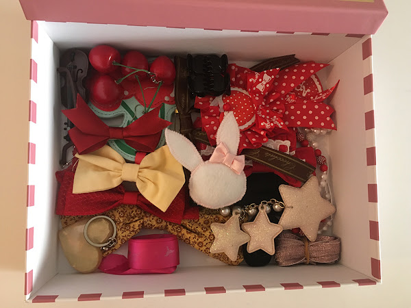 box full of brooches and pins