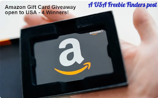Image shows a hand holding an Amazon Gift card in a black frame Link opens in a new tab on the giveaway site. Text reads Amazon Gift Card Giveaway Open to USA - 4 Winners