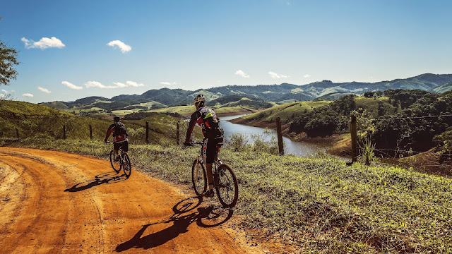 Cyclists on Hills HD Wallpaper