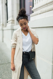 pancake stacker wearing a Two Feathers trench coat, River Island straight leg jeans; Everlane black oxfords, a white tee, and a Zara fanny.