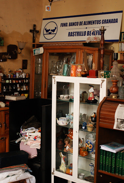 vintage items for sale interior of flea market in Spain - Photograph by Tim Irving