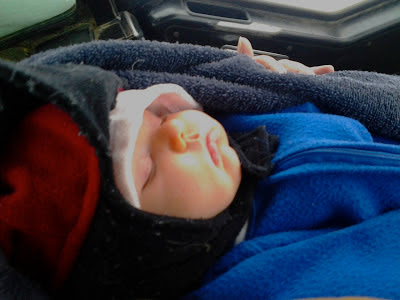 sleeping baby all bundled up in winter clothes