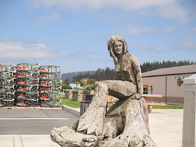 Redwood Chainsaw Carving of a Mermaid and Crab Pots in Crescent City