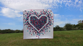 Heart quilt with quarter square triangles