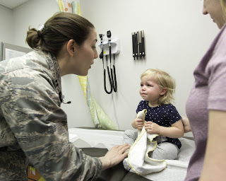 Every year, roughly 8 to 12 percent of the physicians graduating from USU become pediatricians. Lt. Allison Wessner, USU class of 2011, a pediatrician at Naval Hospital Jacksonville, conducts a check-up on one of her patients in 2017.  Wessner was selected as the 2017 Navy recipient of the Outstanding Young Pediatrician Award from the American Academy of Pediatrics’ Uniformed Services Chapter East. (U.S. Navy photo by Jacob Sippel, Naval Hospital Jacksonville/Released).