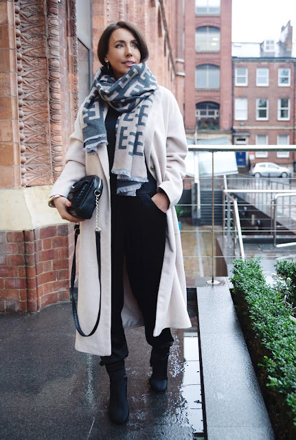 Woman in cashmere scarf and winter coat