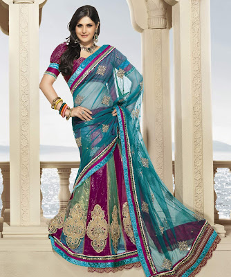 Zarine Khan  BRAND: Brijraj CATEGORY: Lehenga Saree with Unstitched Blouse COLOUR: Saree: Teal Green and Multi Blouse: Magenta  MATERIAL: Saree: Net Blouse: Poly Dupion