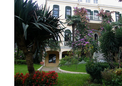 Stunning view of a house with its beautiful lawn in Buyukada.