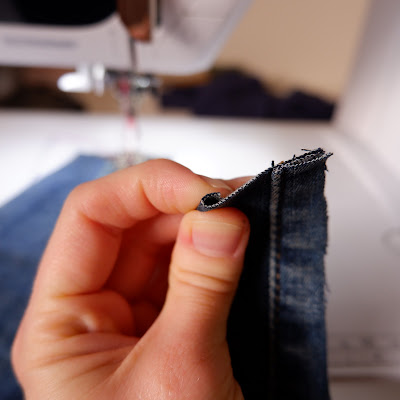 Flat-felled jeans seam step 1. Turning one seam allowance half under. Here by 5 mm as I’m using 1 cm seam allowances.