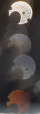 column of orbs with holes