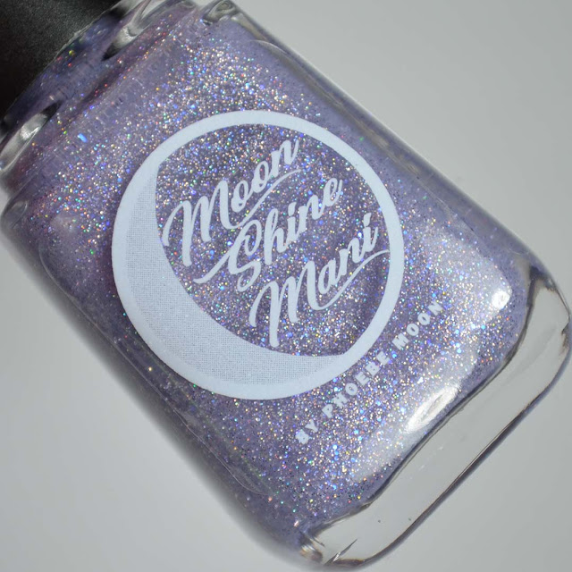 purple sparkle nail polish in a bottle