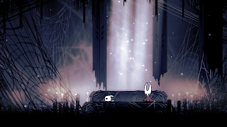 the knight and Hornet in front of a shrine surrounded by candles and dark cobwebs