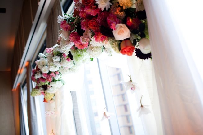 The aisle was lined with a thick layer of rose petals vases with submerged