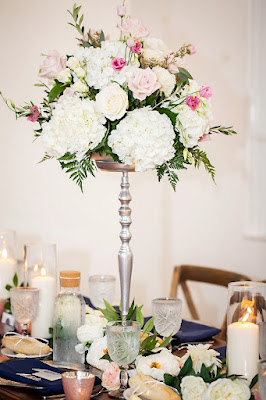 tall floral centerpiece on silver stand