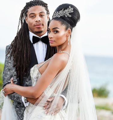 Philip Wheeler with his wife Ashley Nicole Roberts on their wedding dress