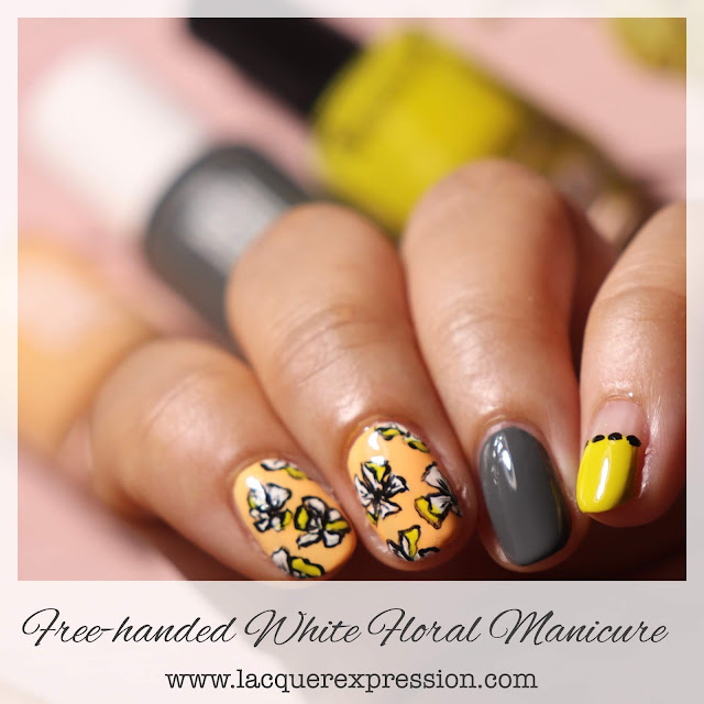 Hand painted white floral summer nail design with peach and chartreuse nail polish
