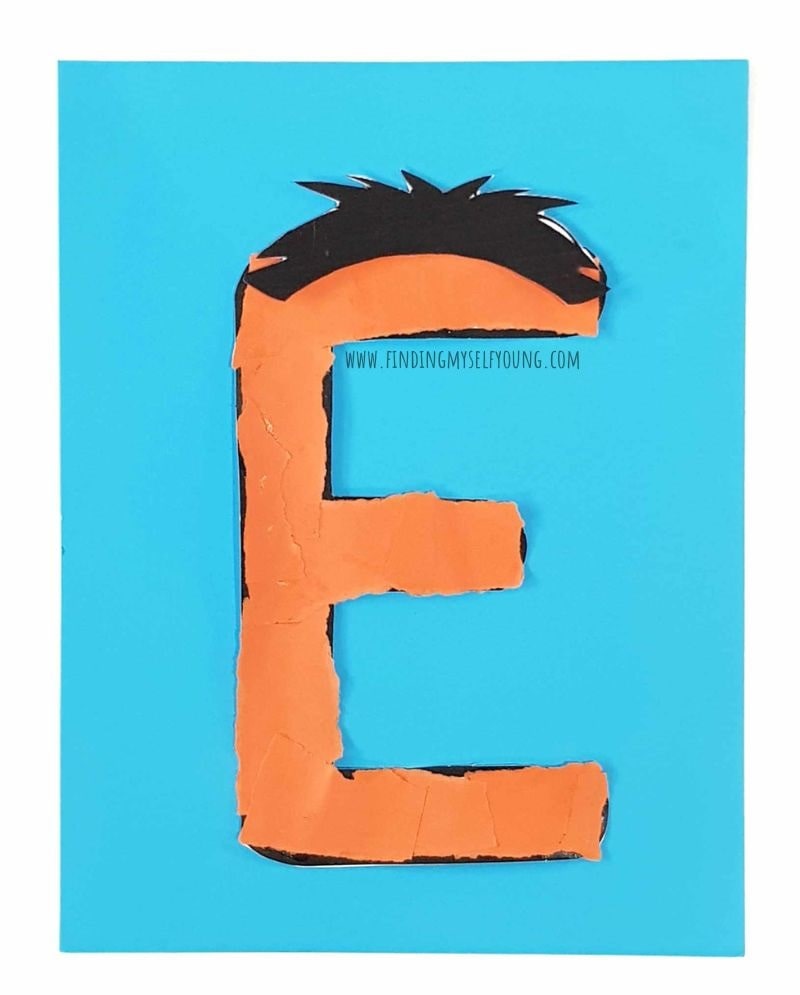 letter E with hair added.