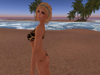 blonde thong bikini leopard beach palm trees ocean