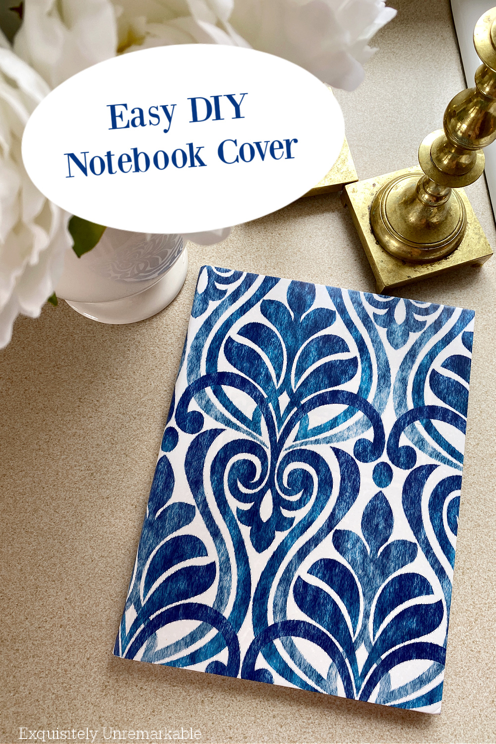 Easy DIY Notebook Cover text over notebook on counter between flowers vase and candlesticks