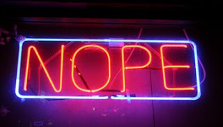 Light sign that says, "NOPE"