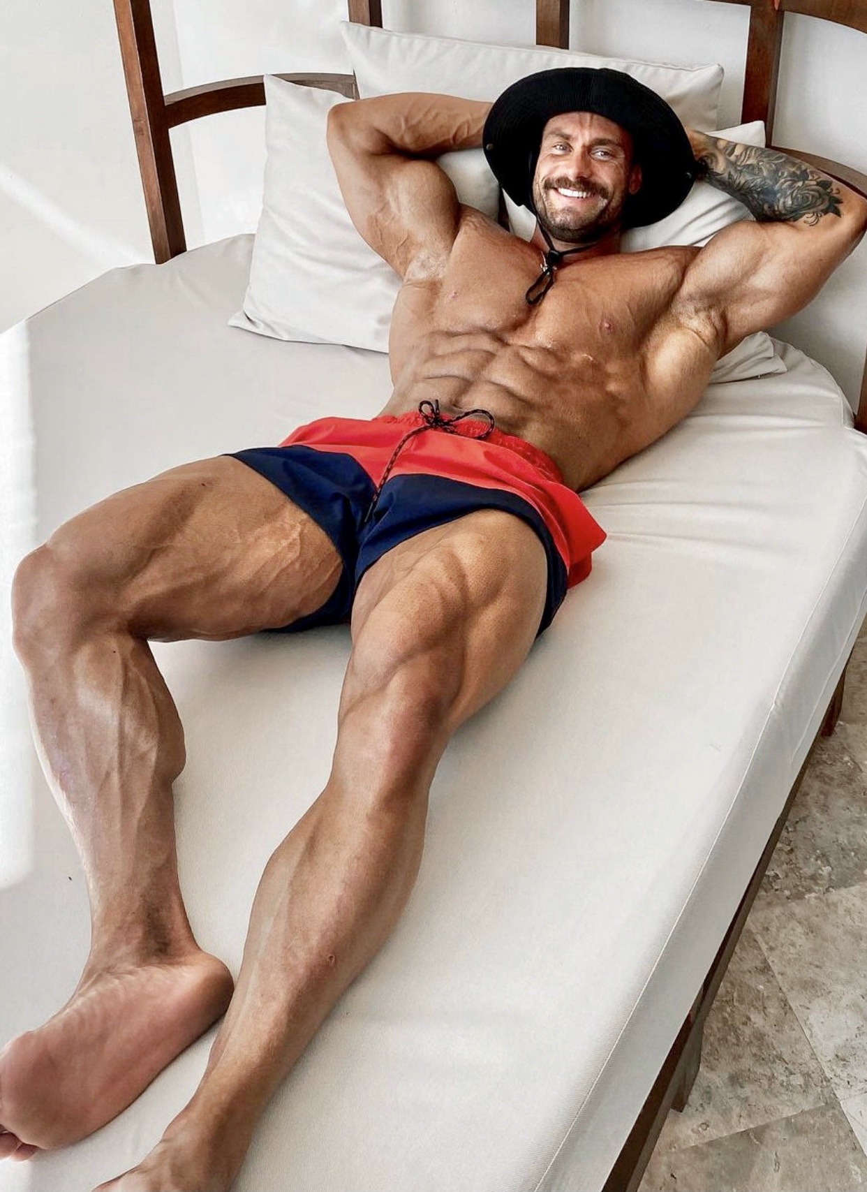 strong-sexy-barefoot-man-smile-laying-shirtless-masculine-alpha-daddy-bodybuilder-abs