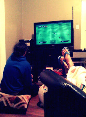 watching my roommates, chrissy and jj play fifa 2010.