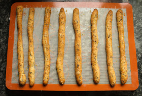 Food Lust People Love: Crunchy and savory, these cheddar poppy seed bread sticks make the perfect munchable for snack time or even happy hour, with a cold glass of beer or wine of any color.