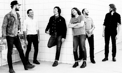 "Lirik Lagu The War On Drugs - Holding On"