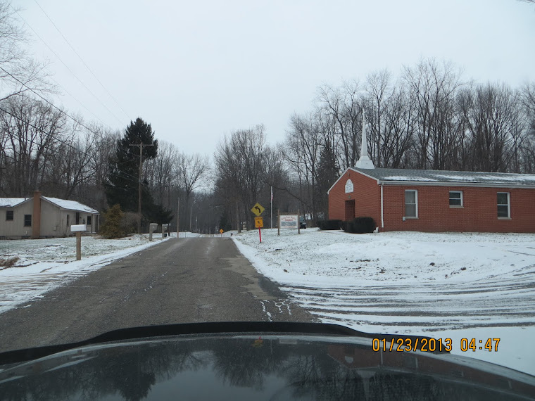 BLV cop John Delillo hiding behind the church sign on Cox Avenue in BLV.