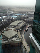 I flew in at night, Dubai airport is actually a mall that planes park at. (photo )