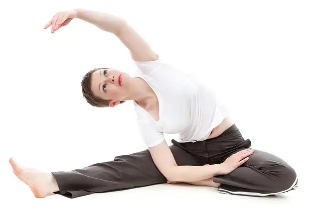 Female practicing yoga, demonstrating the benefits of exercise for flexibility and mindfulness