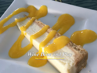 New York Cheesecake with mango sauce at Seabreeze Island Grill in Redington, Florida