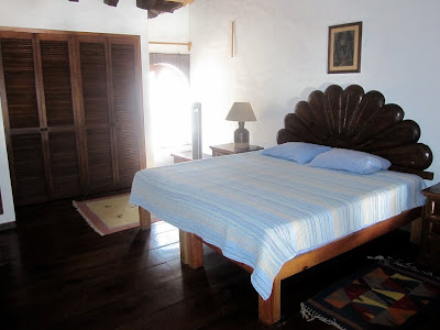 queen-size bed in the bedroom of the Puerto Vallarta condo loft