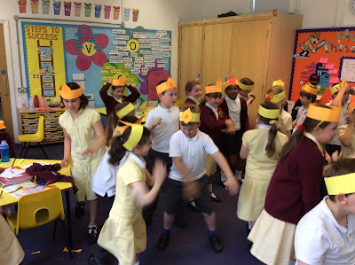 Wearing headbands and playing musical statues