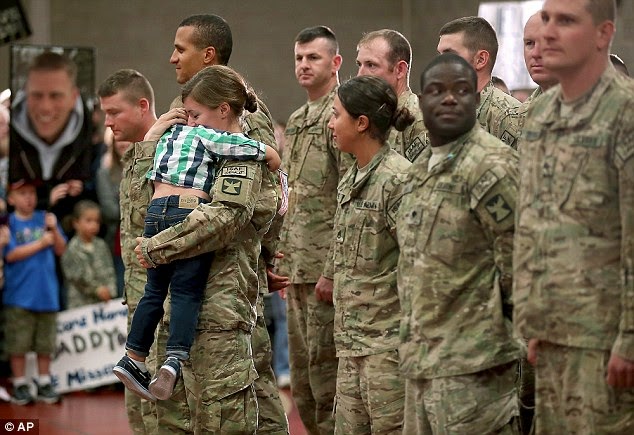 Cooper hugs mom Kathryn Waldvogel, child hugs mom in military, three-year-old interrupts homecoming procession to hug his mother