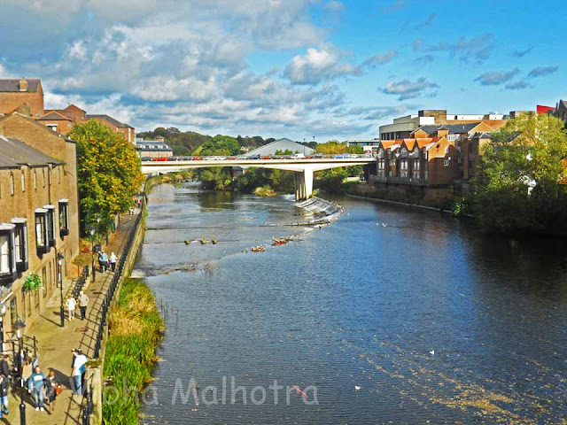 Durham, Bridges, Elvet Bridge,  Framwellgates, Millburngates, Prebends, River Wear, United Kingdom, Tyne and Wear,During our visit to Durham, the one thing that overwhelmed me was the sheer number of bridges in the city. But on looking closer at the geography of the city, it does not seem so strange because the river Wear crosses the city not once but twice. It forms a kind a peninsula. So if you have to get from any one given point to the other, you need to cross atleast two bridges over the rivers. Most of these bridges are very old, but there are a few new ones as well.The Millburngates Bridge - This was different from most of the other bridges in its obviously modern architecture and construction. The photo was clicked from the Framwellgates Bridge, which leads up to the Durham Castle and the Cathedral.Perhaps the most scenic of all the bridges, this is the old Elvet Bridge The bridge was constructed in 1160 AD and provides some spectacular views of the river Wear. A walk originating from the river running parallel to the river Wear should not be missed.This shot was taken from the Framwellgates Bridge as well. The bridge in the distance is the Prebends Bridge after which the river takes a sharp U turn. The towers looming in the top-left are the West Towers of the Durham Cathedral.This is on the top of the Framwellgates Bridge. The bridge itself is very similar to the Old Elvet bridge in construction though is slightly larger.