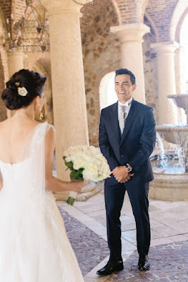 groom smiling while seeing bride for the first time at bella collina