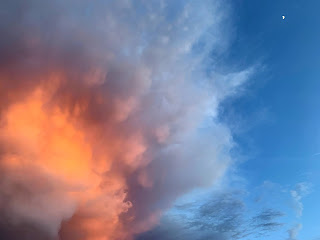 sunset photo with moon and clouds